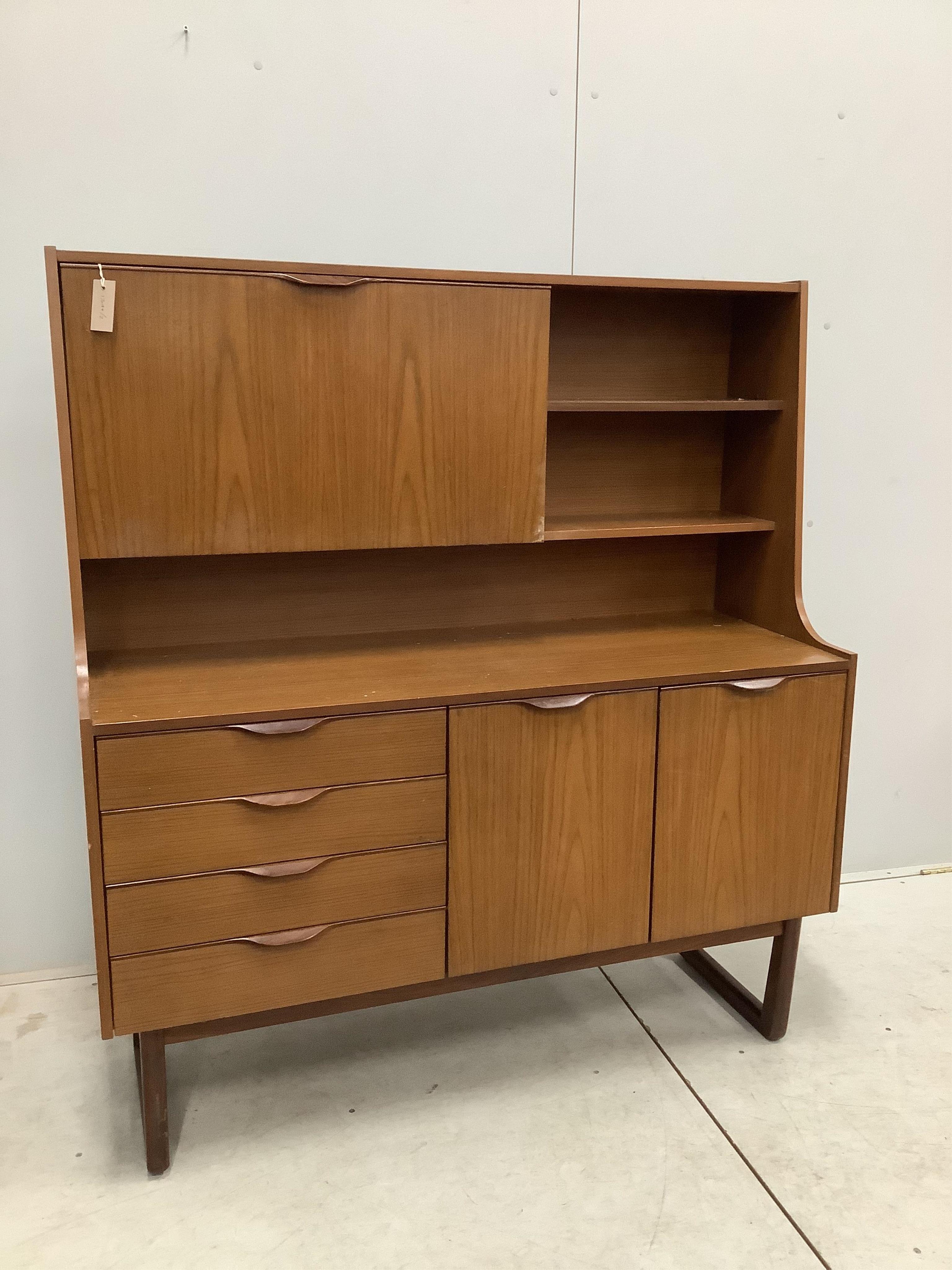 A mid century 'Europa Furniture' simulated teak sideboard, width 125cm, depth 46cm, height 138cm. Condition - fair